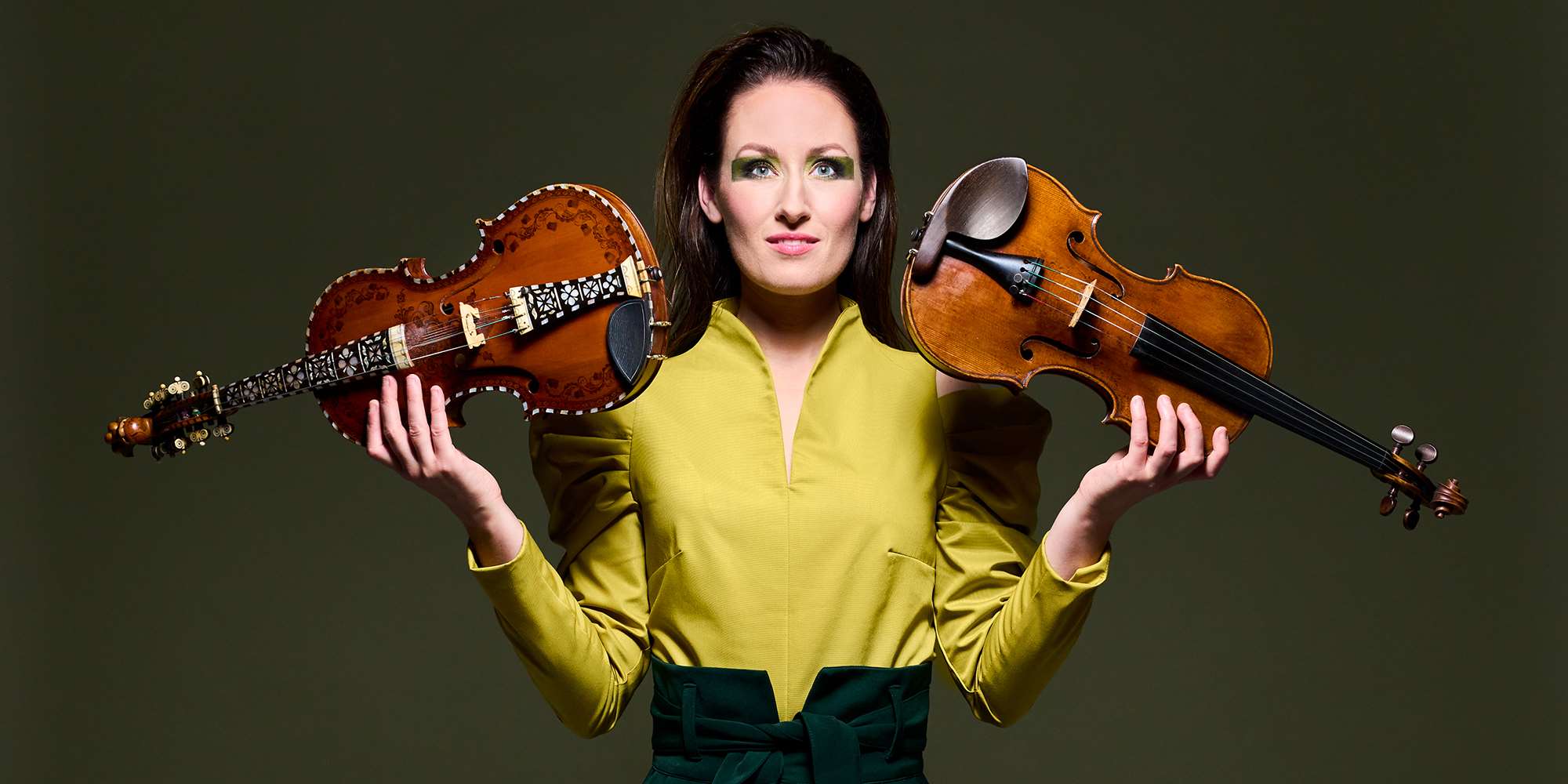 With the hardanger fiddle in one hand and the violin in the other