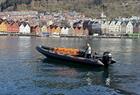 Rib boat with Bryggen in Bergen in the background