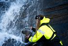 Collecting water from waterfall