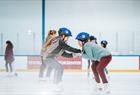 Children ice skating at Vestkanten ice skating rink in Bergen