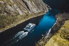 The fjord cruise passes through the narrow Mostraumen