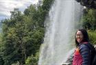 Walking behind the water at Steinsdalsfossen